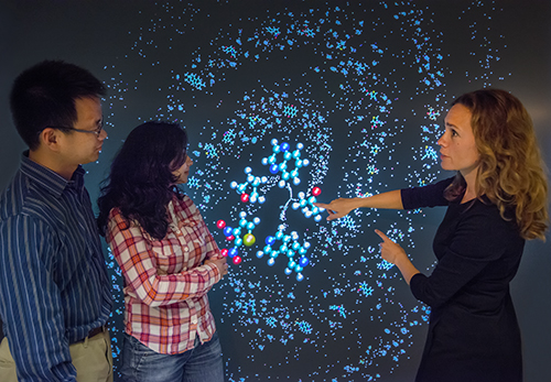 Kristin Persson and her electrolyte genome team (Nav Nidhi Rajput, Xiaohui Qu) with 3D visualization